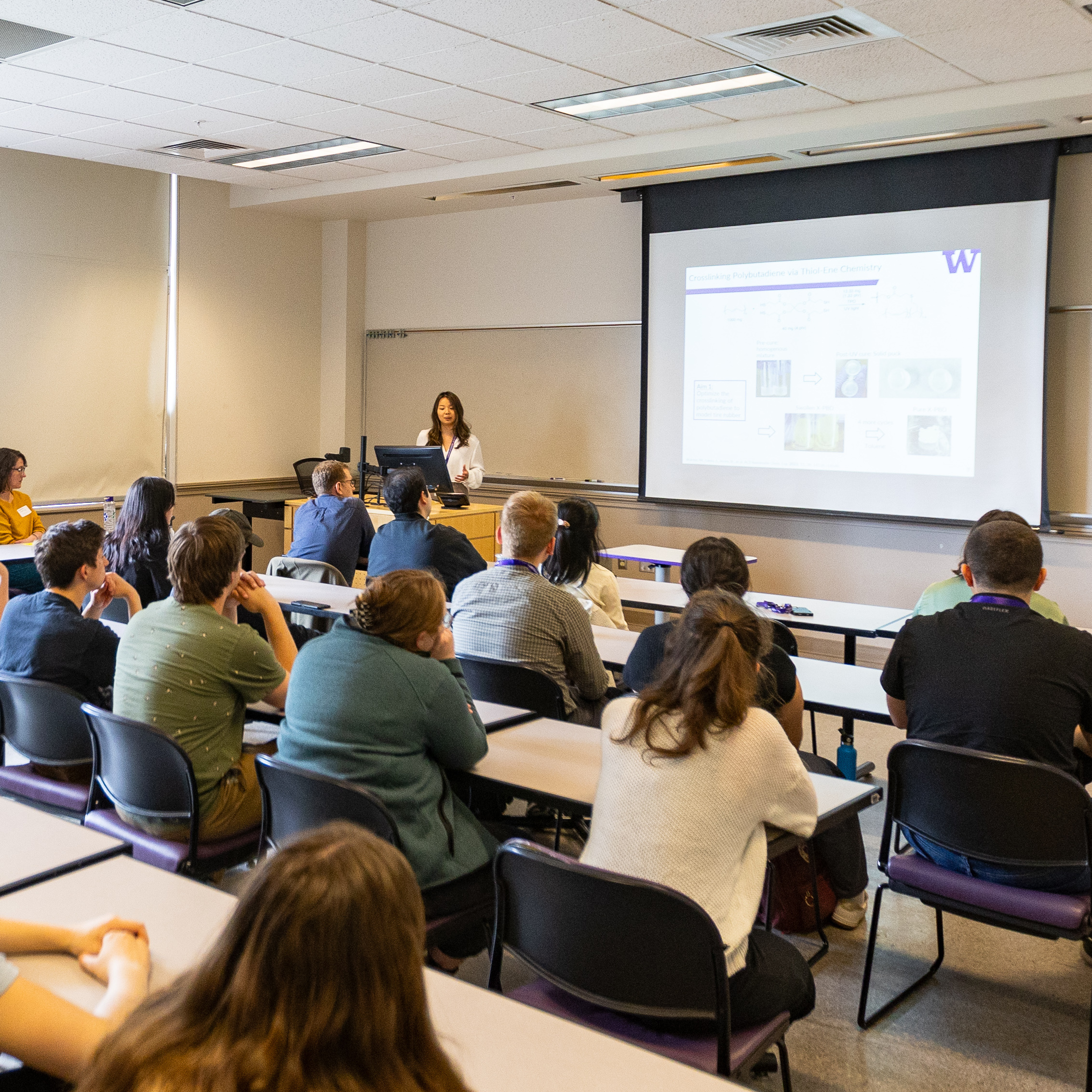 An instructor speaks to a classroom audience